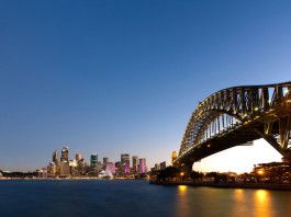 Sydney Harbour at dusk, with bridge on foreground