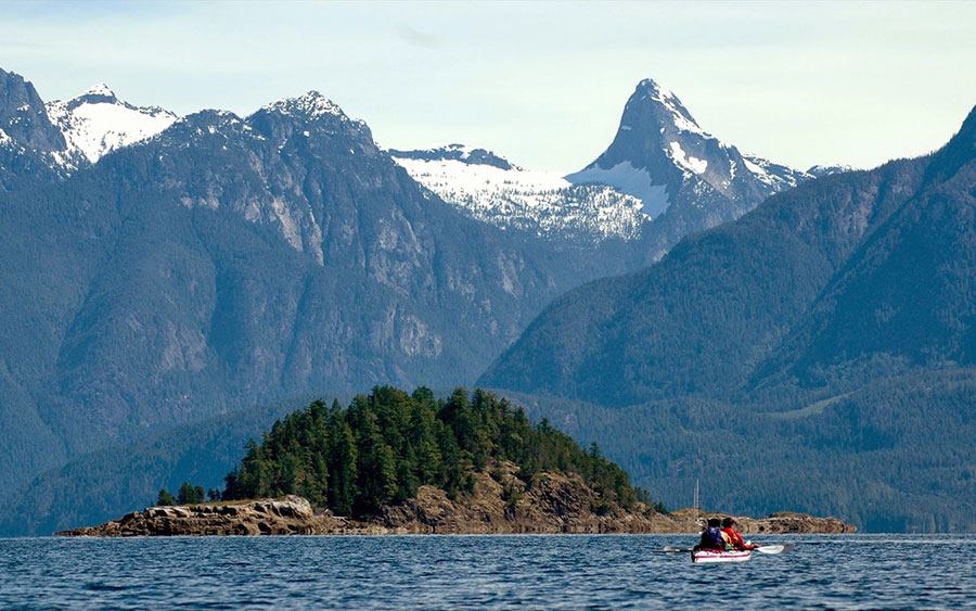 The scenic islands surrounded by mountains in British Columbia are beautiful to behold and to visit by kayak